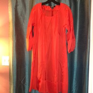 DKNY orangey red dress with pleats at the neck.